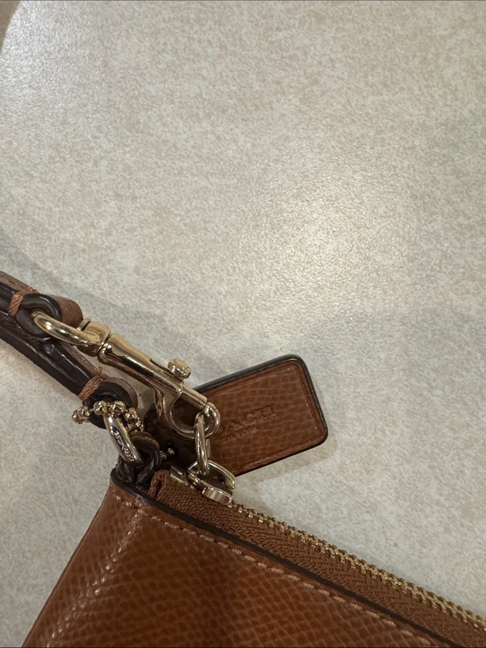 Coach Brown Pebbled Leather Wristlet with Gold Logo
